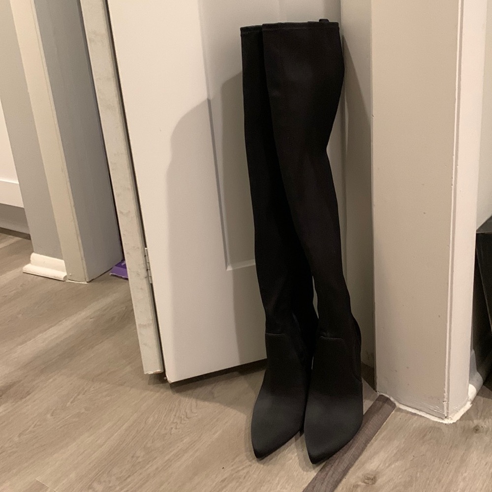 Black satin polyester over the knee boot.